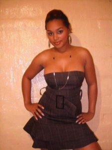 Busty Kenyan Woman Poses in Strapless Mini Skirt Dress – Breathtaking Cleavage