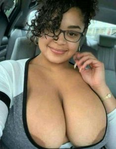 Black Woman with a Busty Chest Takes Out Her Big Boobs