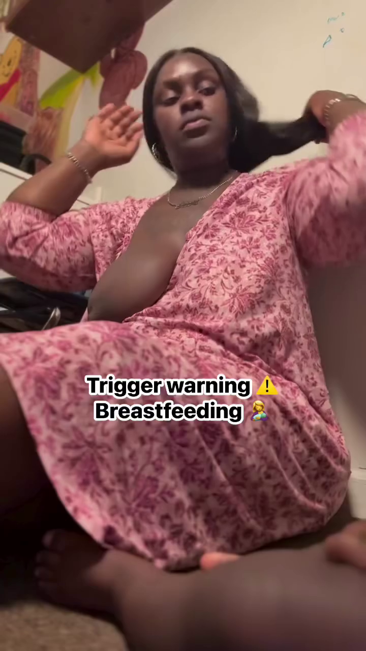 Horny African Woman Hangs Out Her Full Big Breasts - Pulls Her Top Up to Breastfeed - She is Doing for Attention To Attract Thirsty Fans. Exposing Breasts is a common trend on FB
