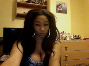 Extremely Beautiful Nigerian Lady with Big Boobs Sits in Office